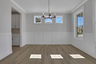 dining room with hard-surface flooring and windows