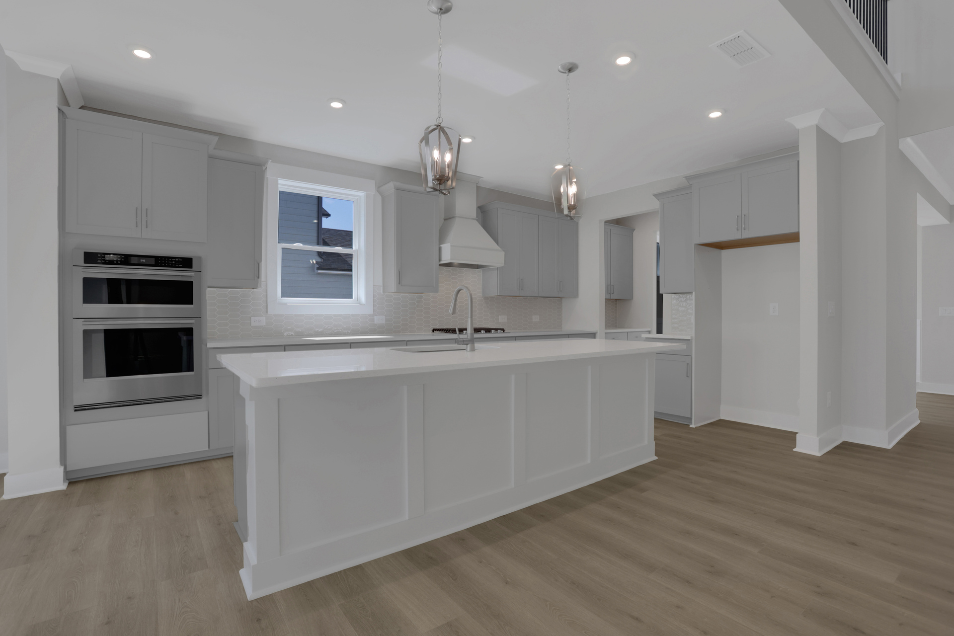 kitchen with white cabinets and white quartz counters