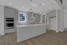 kitchen with white cabinets and white quartz counters