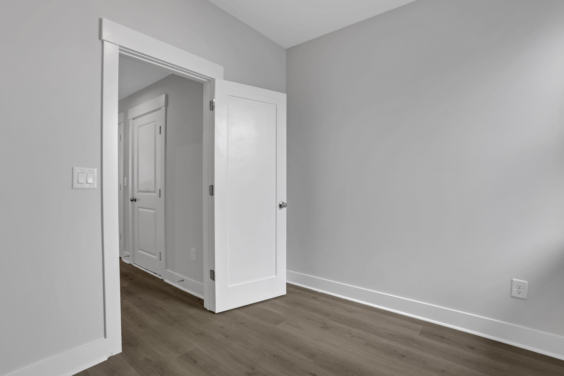 office with hard-surface flooring and gray paint on the walls 