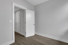 office with hard-surface flooring and gray paint on the walls 