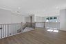 loft overlooking 2-story great room with hard-surface flooring