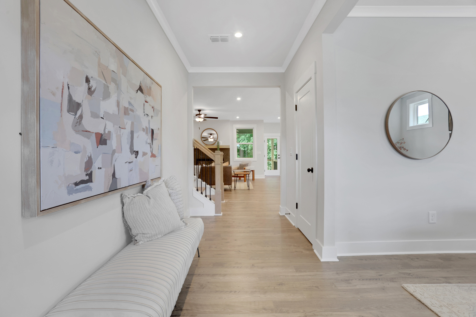 foyer with hard surface flooring open to the dining room