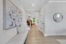 foyer with hard surface flooring open to the dining room