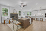 great room with electric fireplace and hard surface flooring