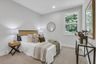 bedroom with windows and carpet