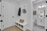 mud room with hard surface flooring and valet