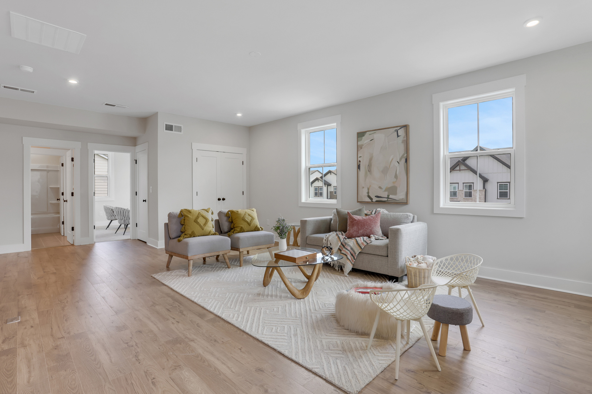 loft with hard surface flooring and windows