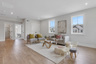 loft with hard surface flooring and windows