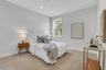bedroom with windows and carpet