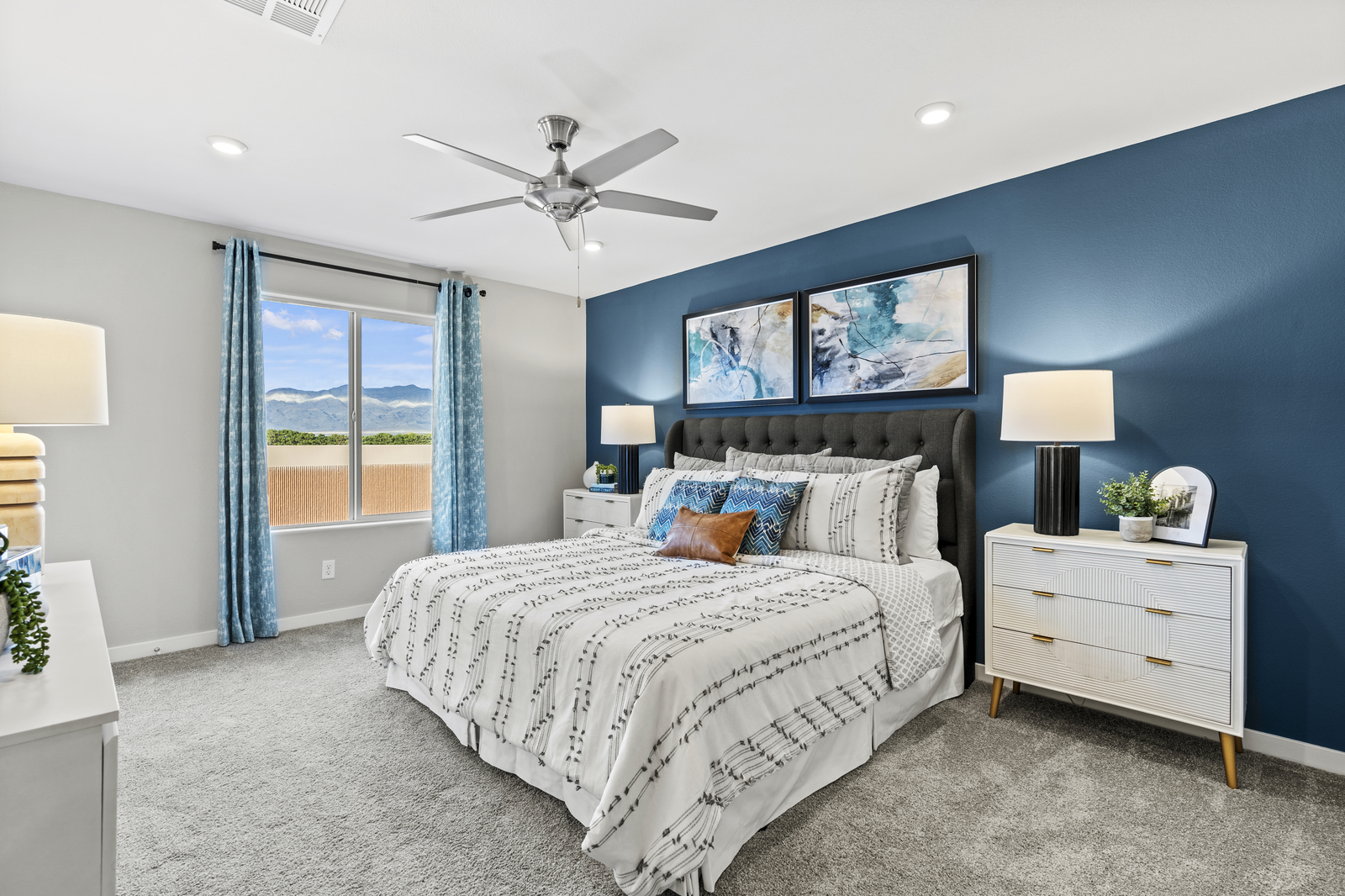 primary bedroom with blue accent wall 