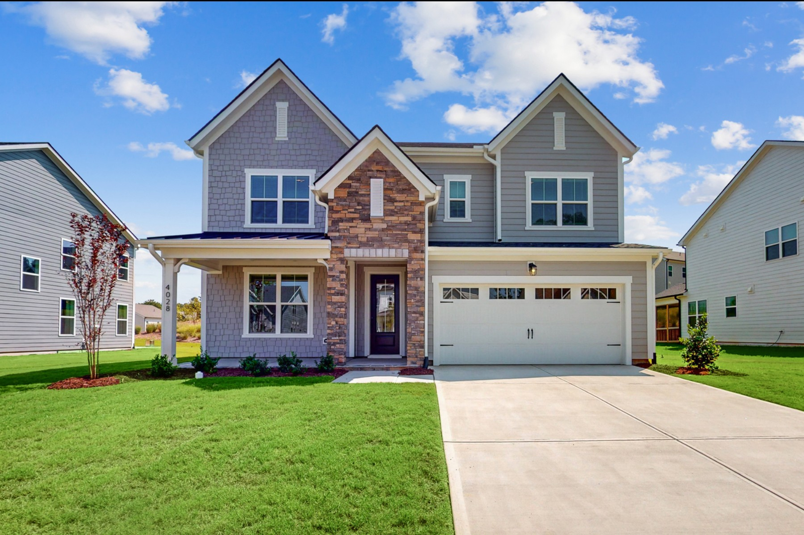two-story single-family home with stone entry