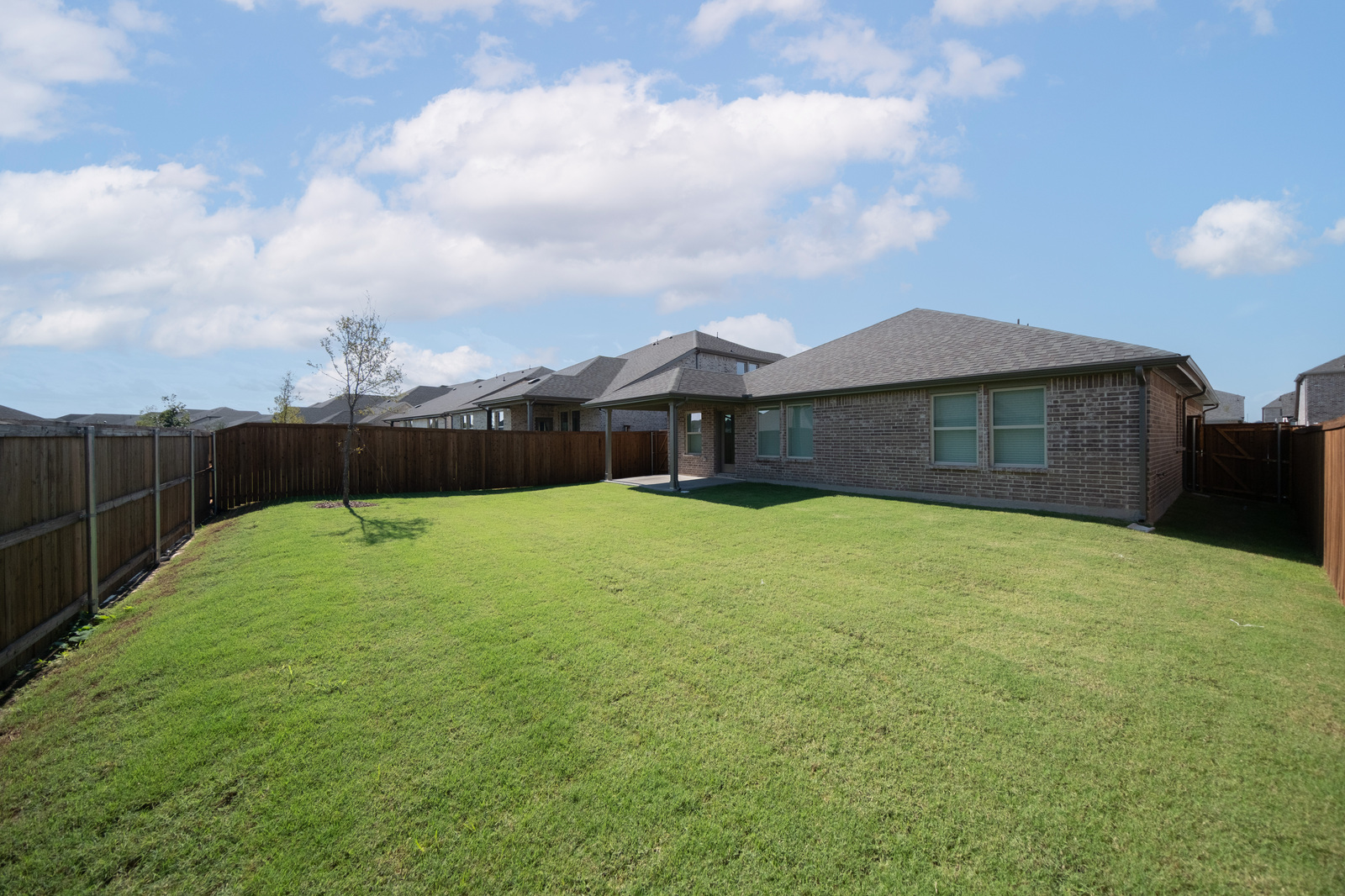backyard of home with covered patio