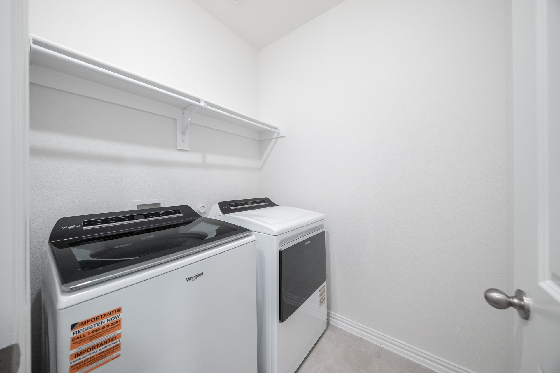 laundry room with included washer and dryer
