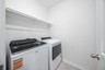 laundry room with included washer and dryer