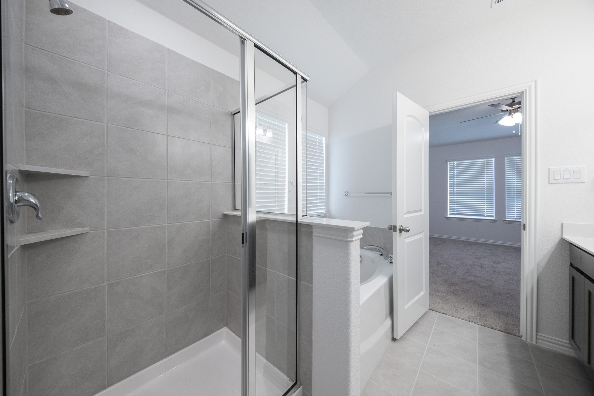 primary bathroom with walk-in shower and soaking tub