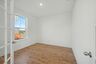 study with french doors, windows, and light wood flooring