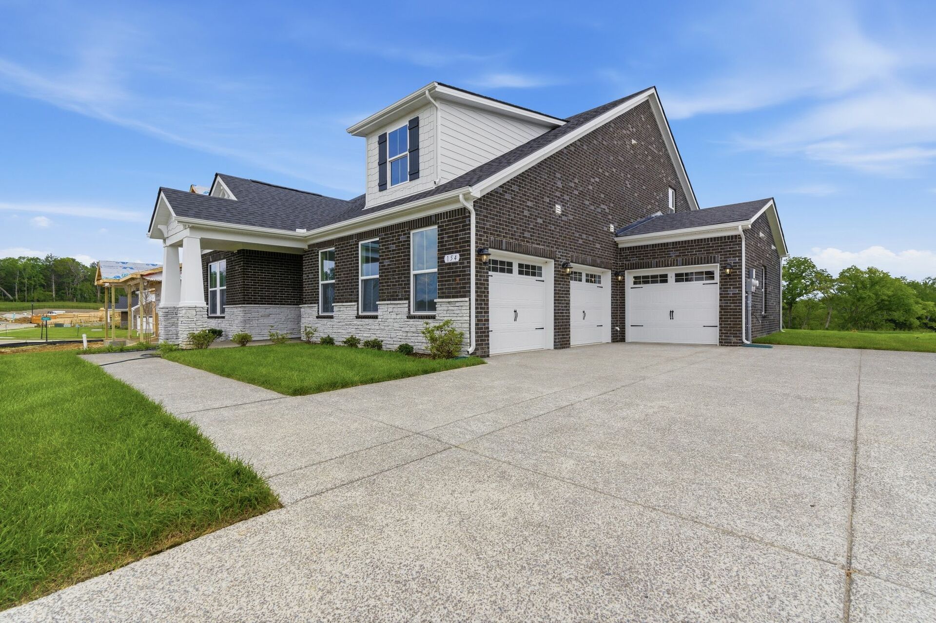 home exterior showing 3 car garage