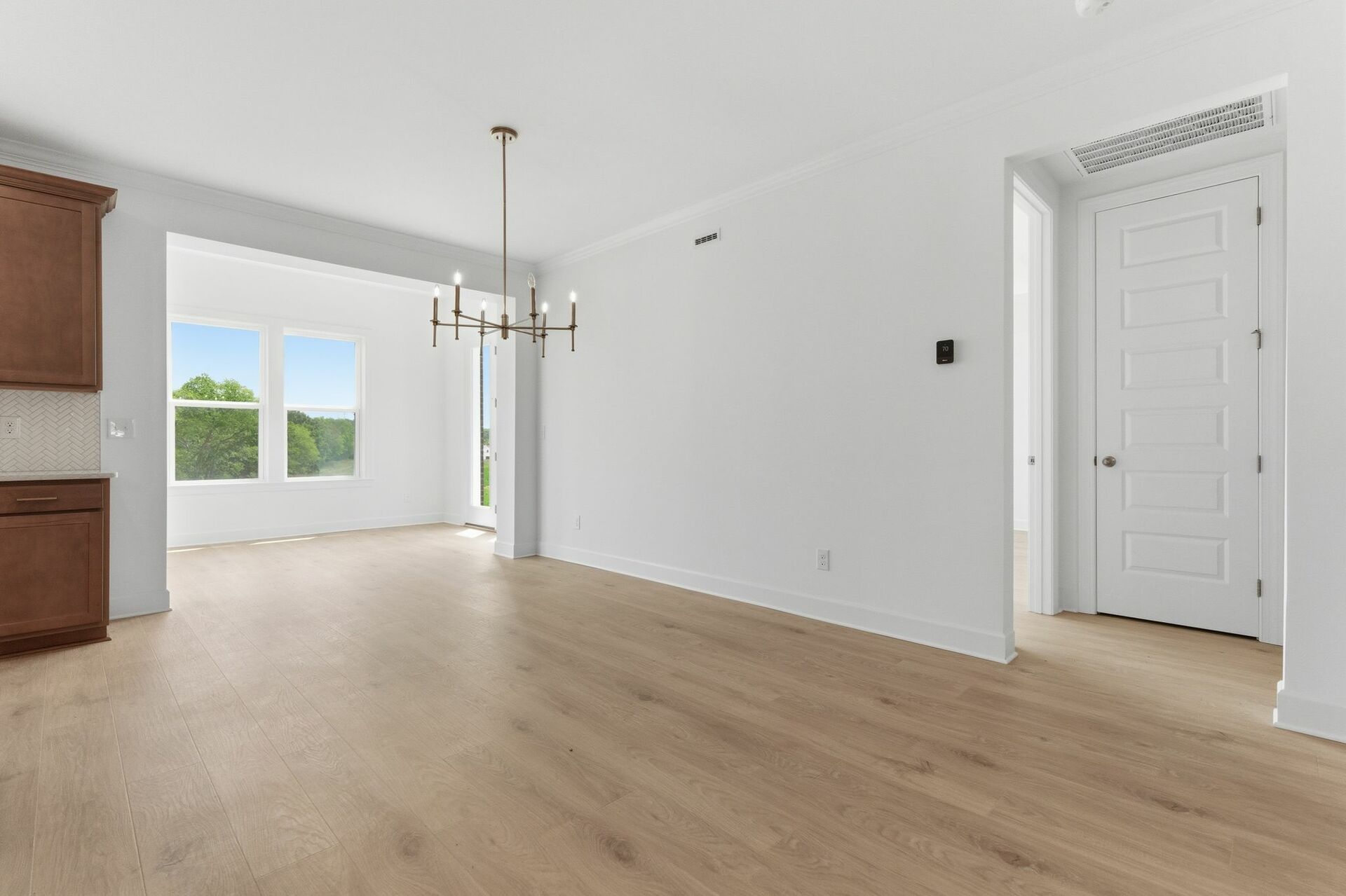 dining room with gold chandelier