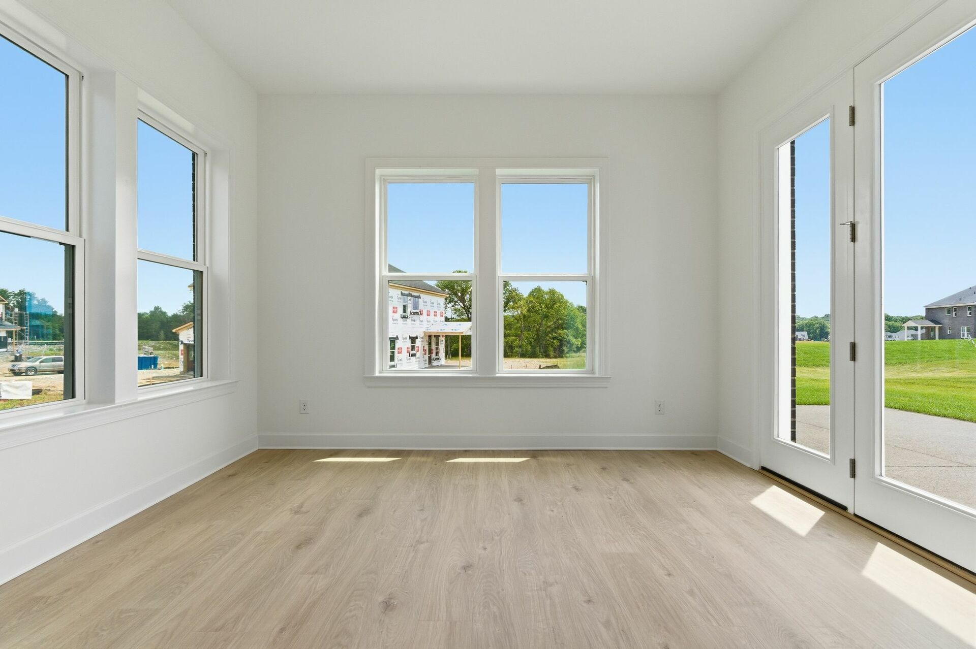 morning room with large windows and patio doors
