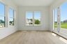 morning room with large windows and patio doors