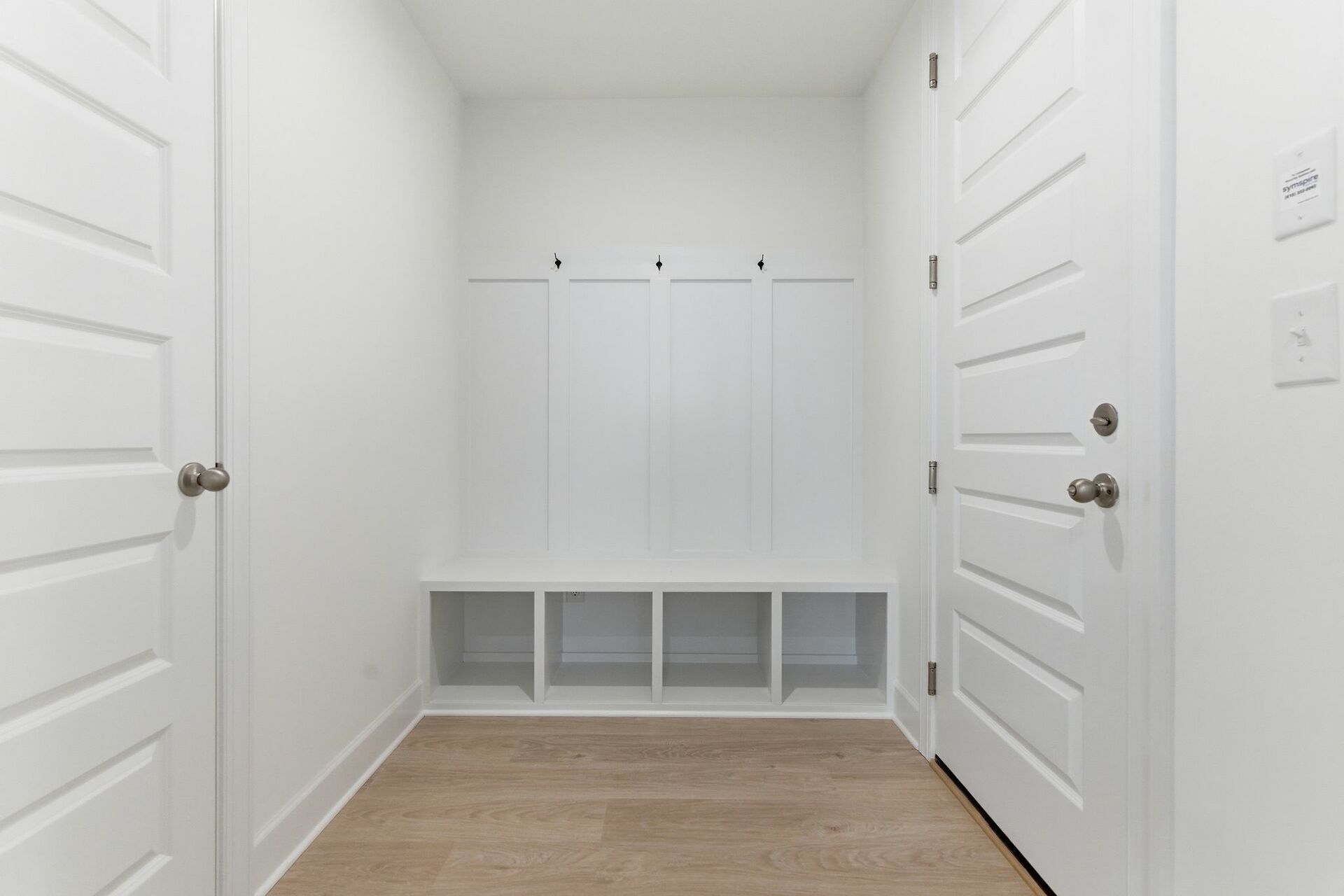 white valet bench with hooks for storage