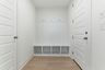 white valet bench with hooks for storage