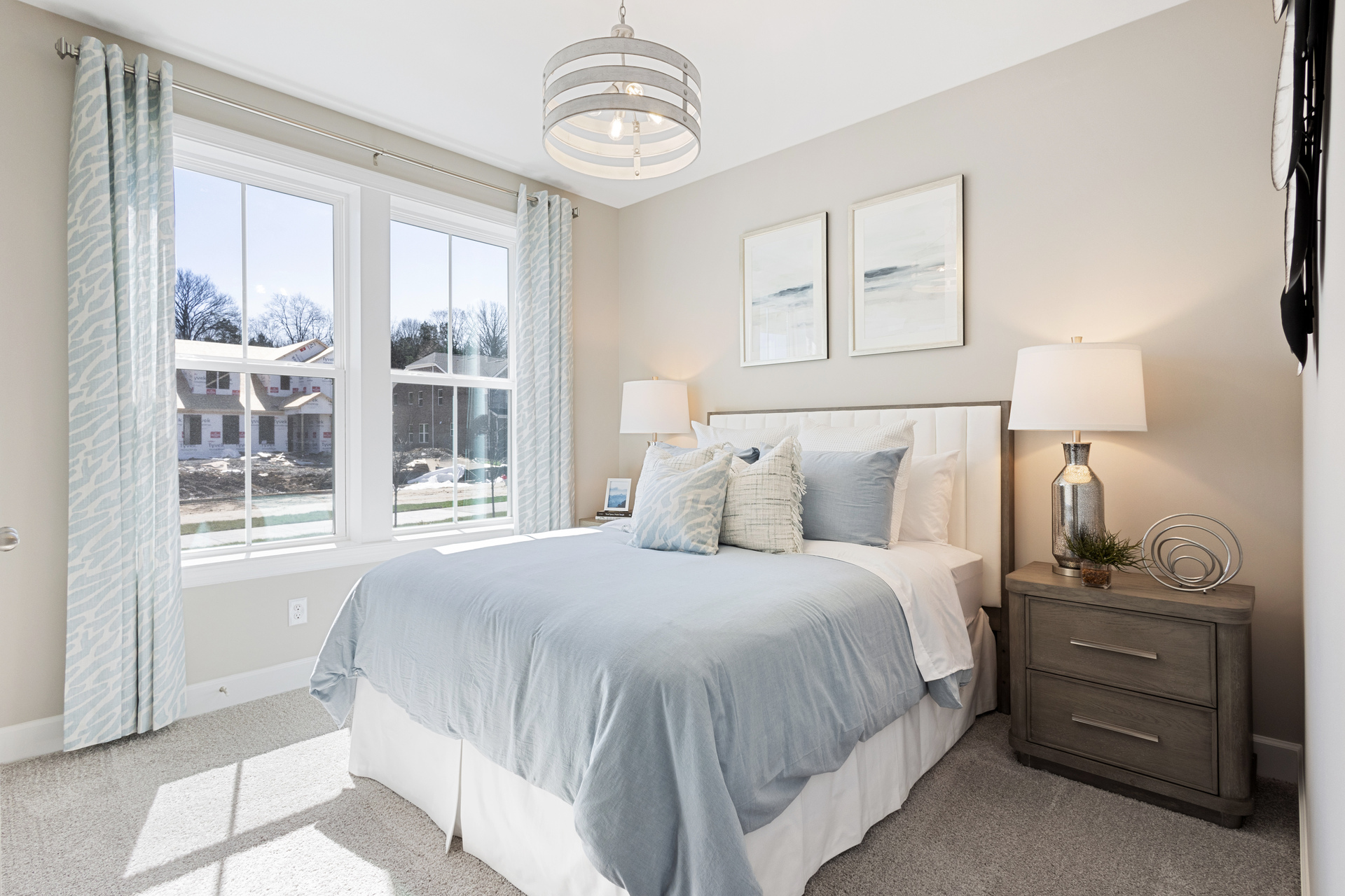 secondary bedroom with large windows and carpet