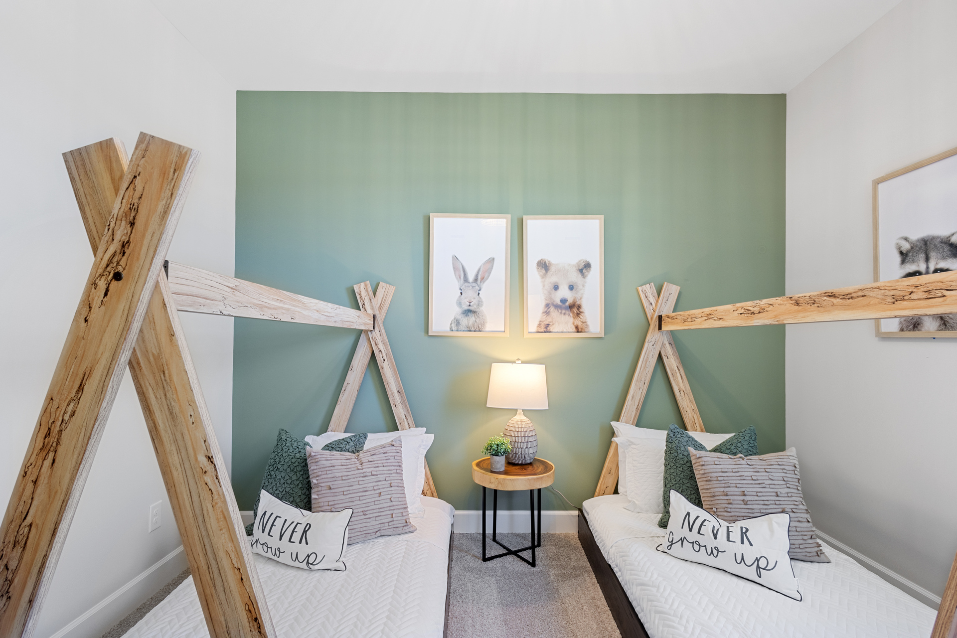 secondary bedroom green accent wall, walk in closet and large window