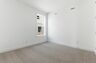 bedroom with light carpet, white walls, and large windows