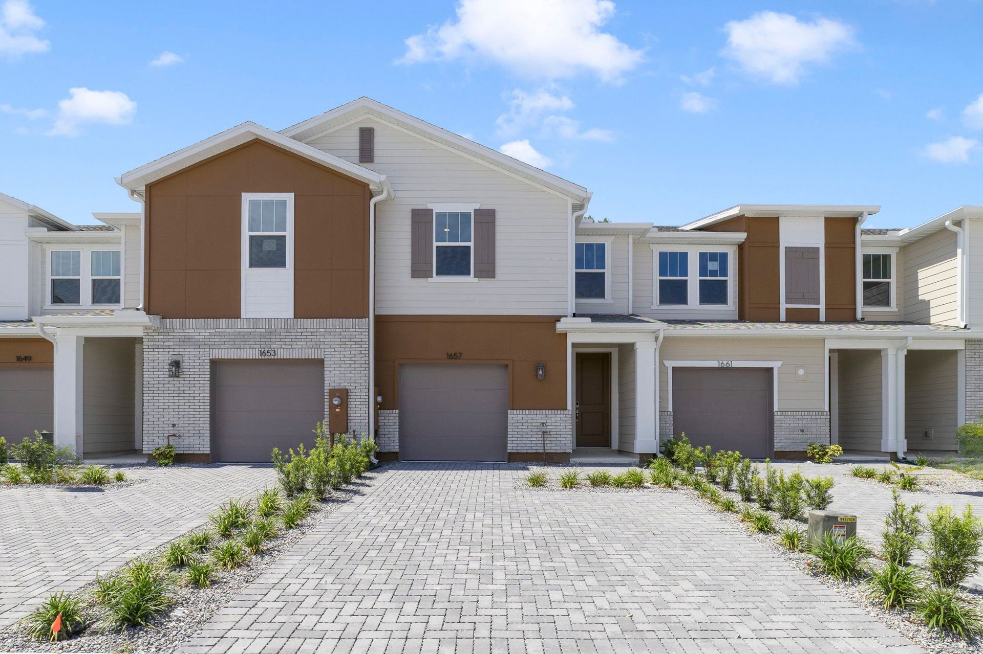 front exterior of home with garage and entrance door