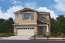 two-story exterior with a cream windowed garage with a brick trim
