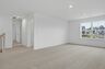 bonus room with oversized windows and carpet