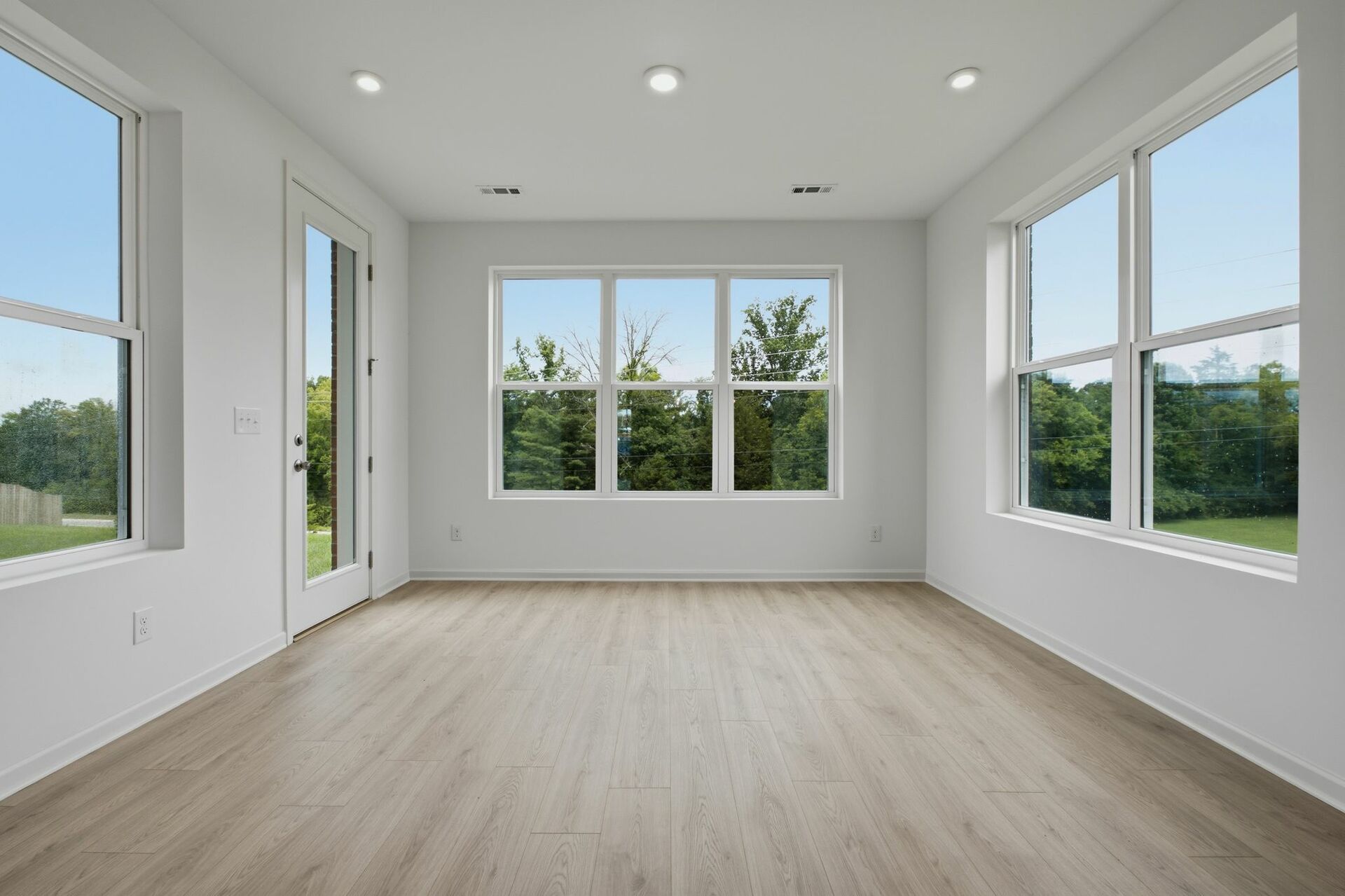 morning room with large windows and white walls