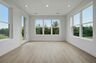 morning room with large windows and white walls