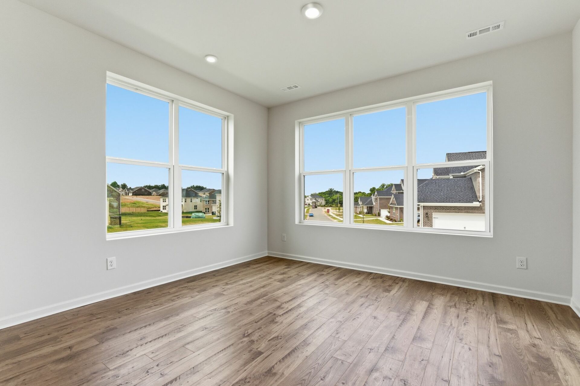 morning room with wood floors and extra large windows