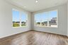 morning room with wood floors and extra large windows