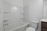 secondary bath with large mirror and tub 