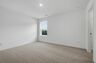 bedroom with carpet and large windows