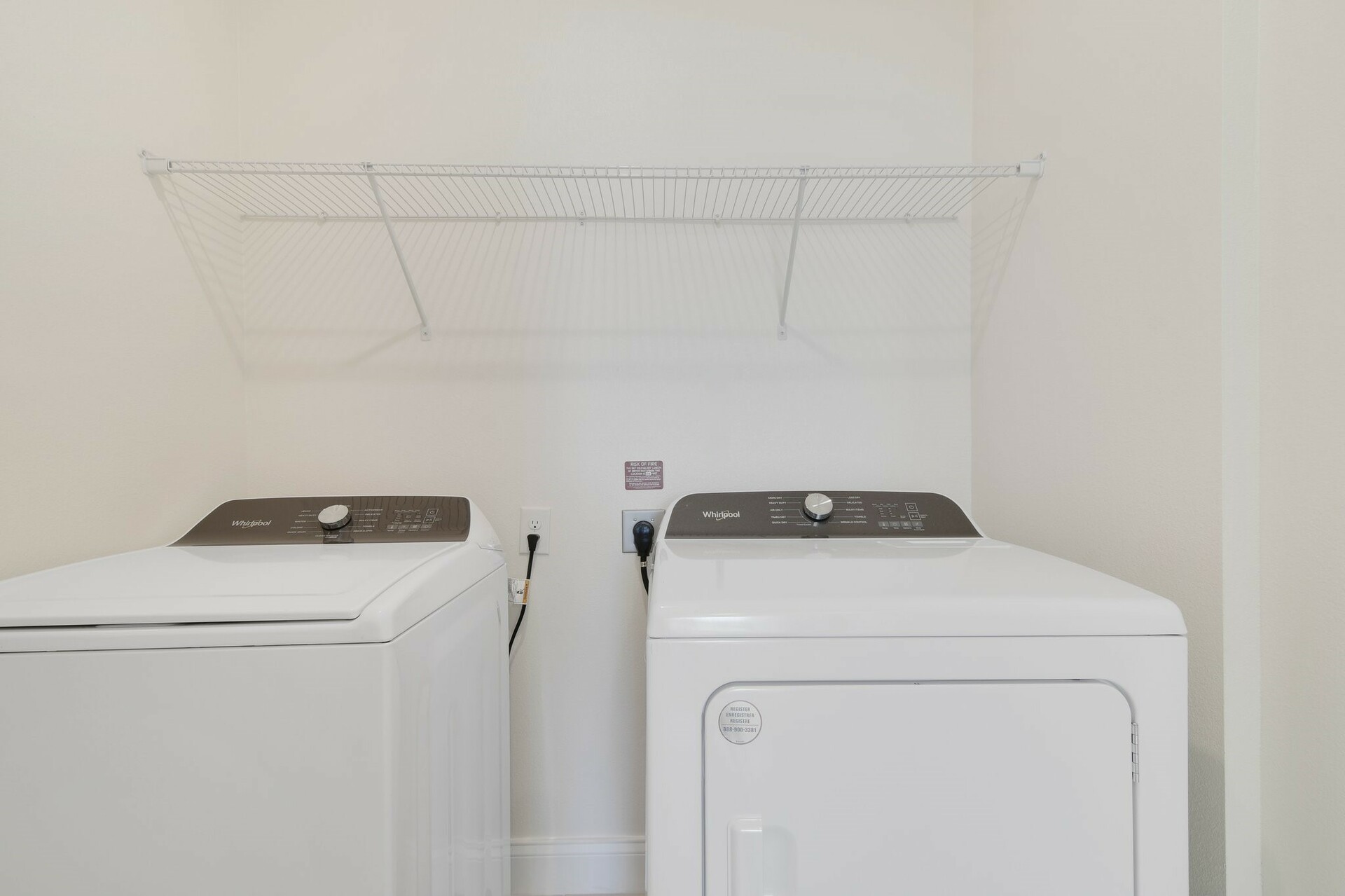 laundry closet with washer and dryer