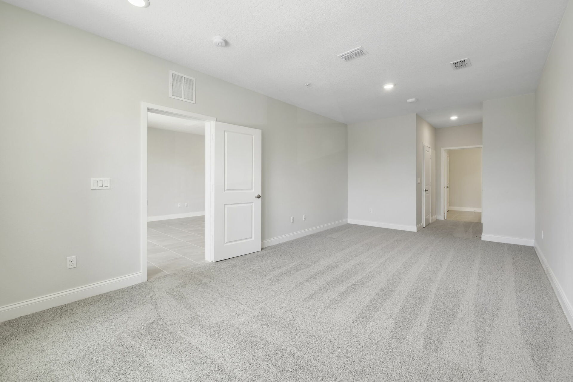 carpet throughout and multiple large windows