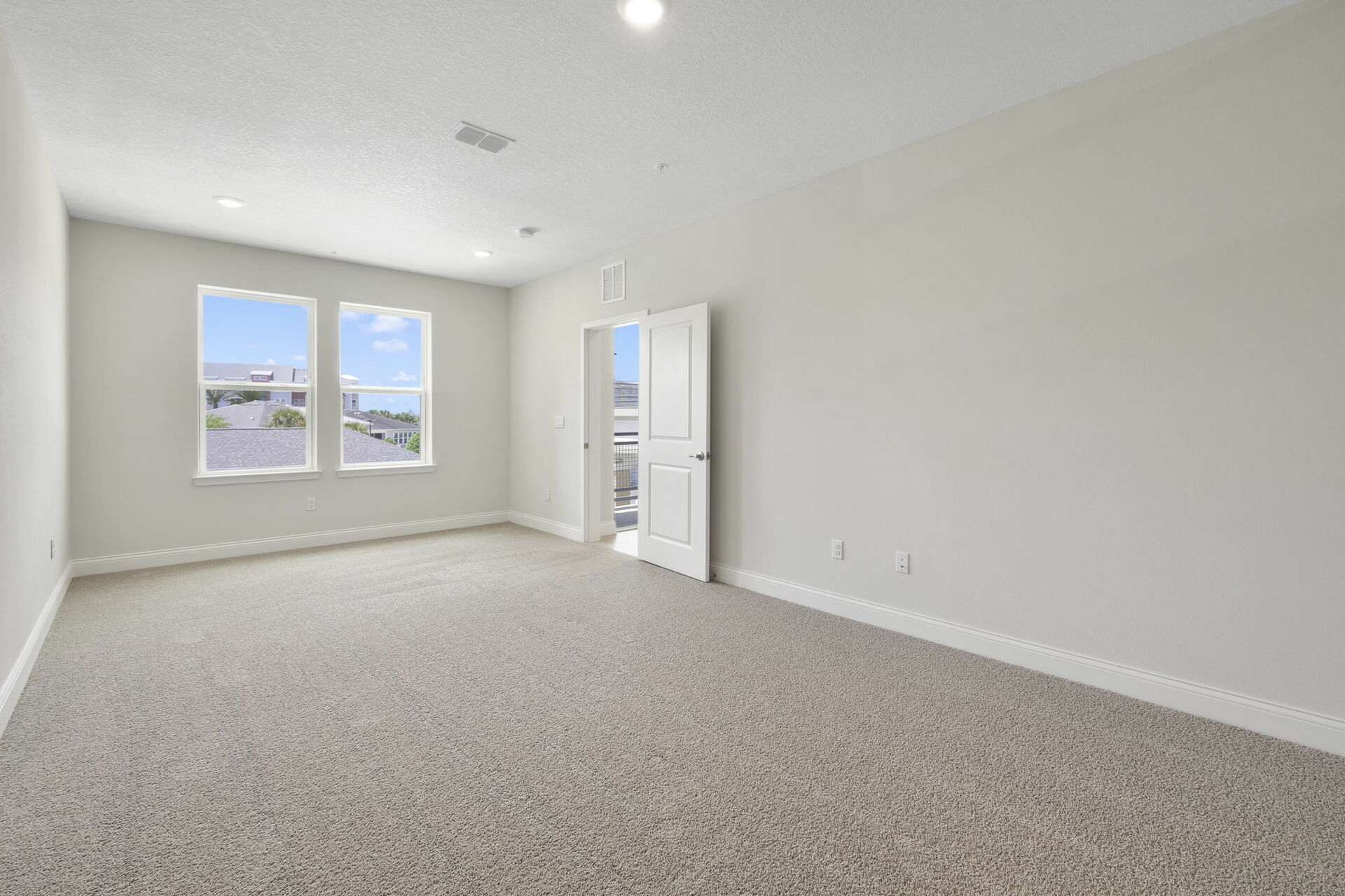 carpet throughout and multiple large windows