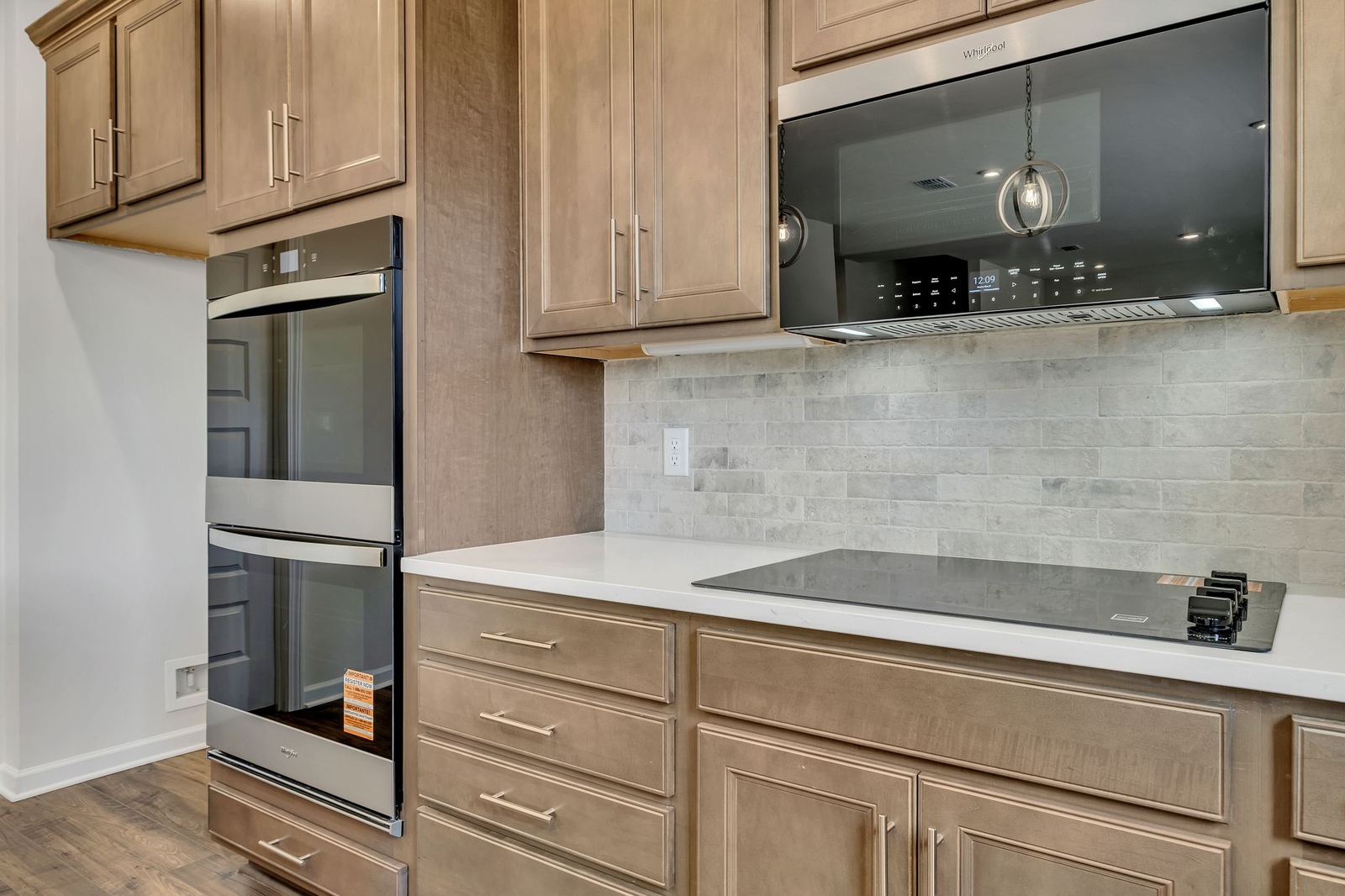 kitchen with wood cabinets, white countertops, and stainless steel appliances