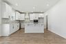 kitchen with white cabinets and large island