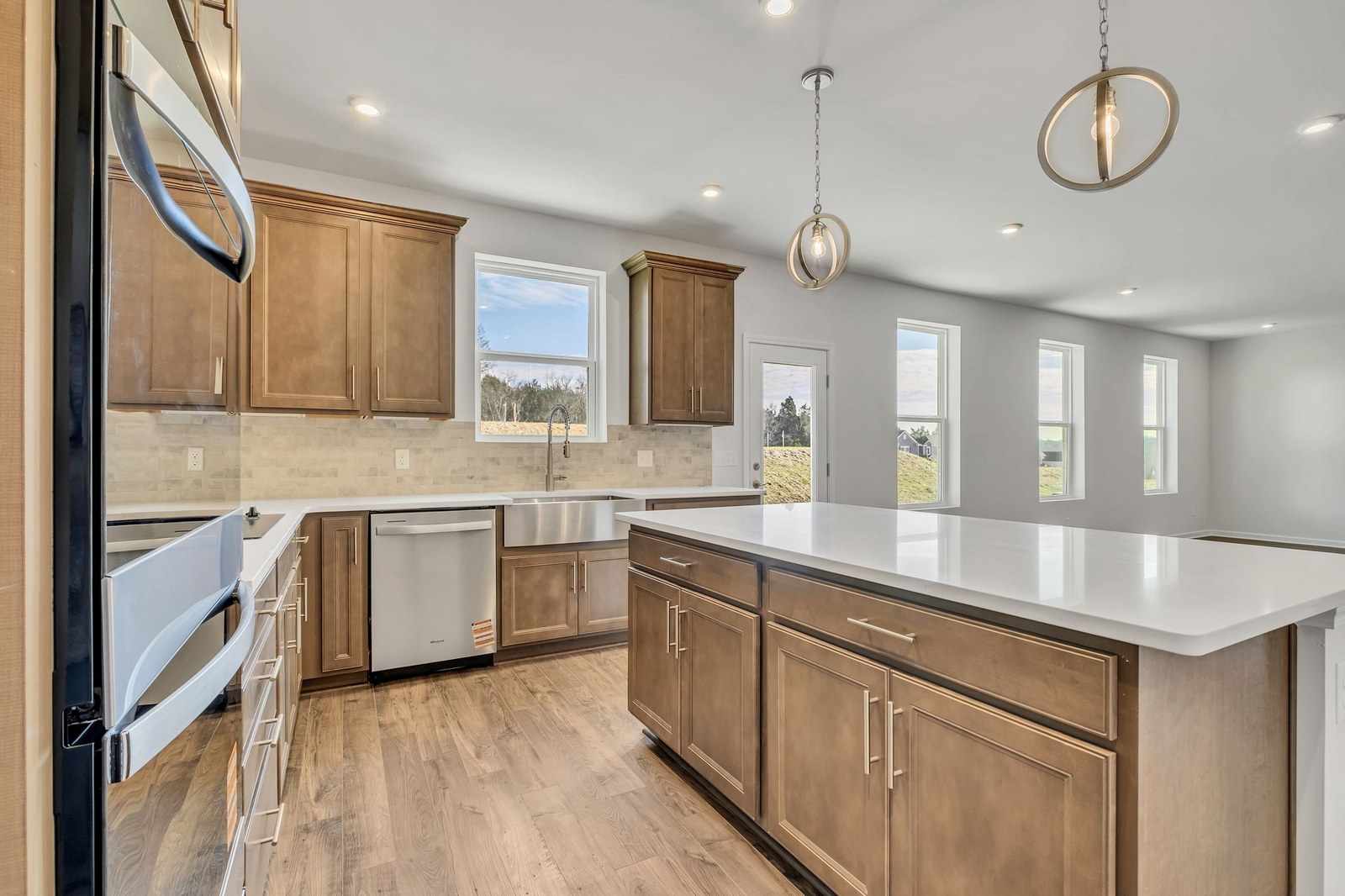 kitchen with wood cabinets, white countertops, and stainless steel appliances