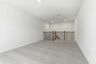 upstairs loft with large windows and carpet