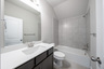 guest bathroom with soaking tub