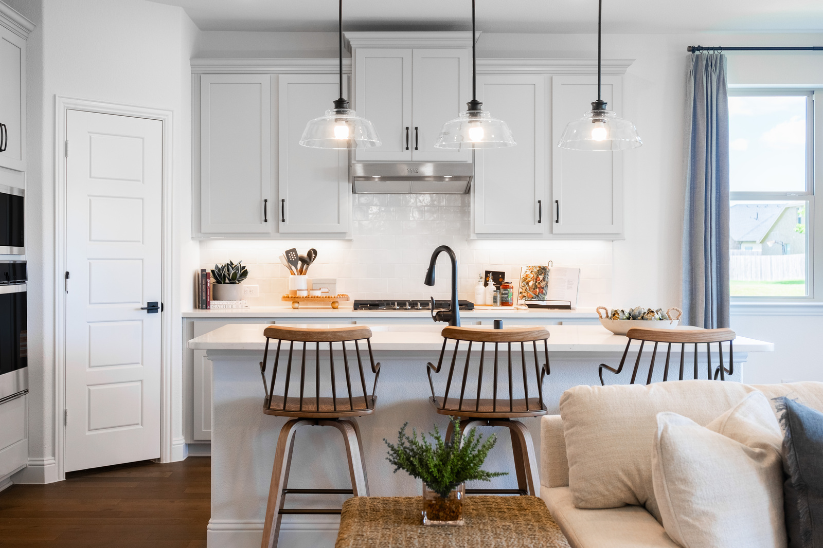 open kitchen with large island and wood floors