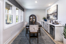 basement with wet bar and hard-surface flooring