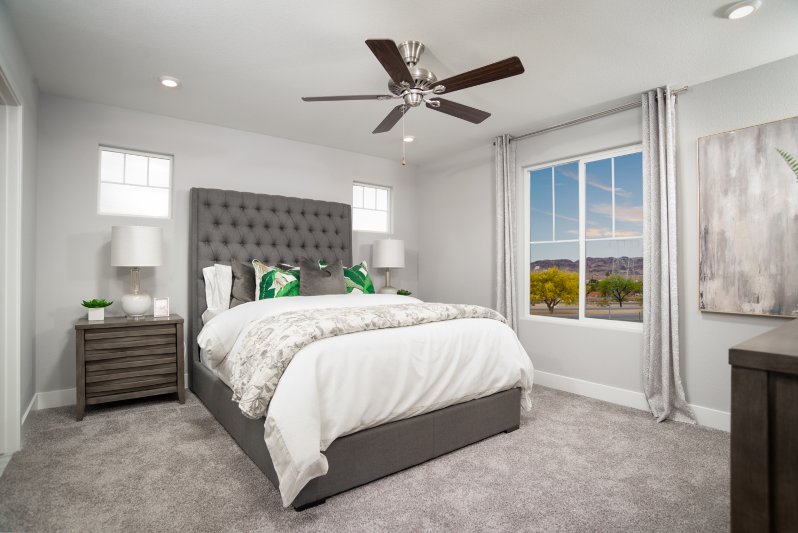 primary bedroom with carpet floors and ceiling fan